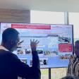 Discussing response to zoonotic outbreaks in Uganda during a poster presentation. David Mugume (UCSF) and Angella Musewa (AFROHUN Uganda)*